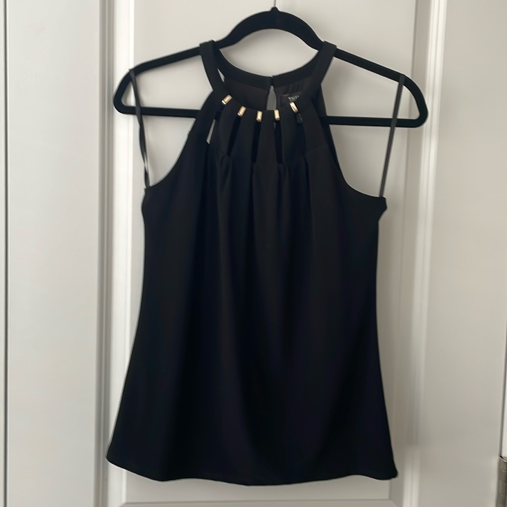 Women’s top size extra small. And great condition.